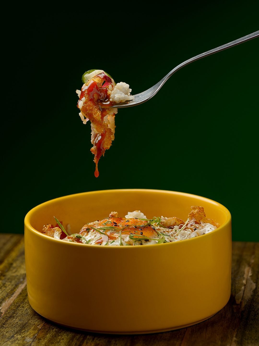 KOYA rice bowl lifted with a fork